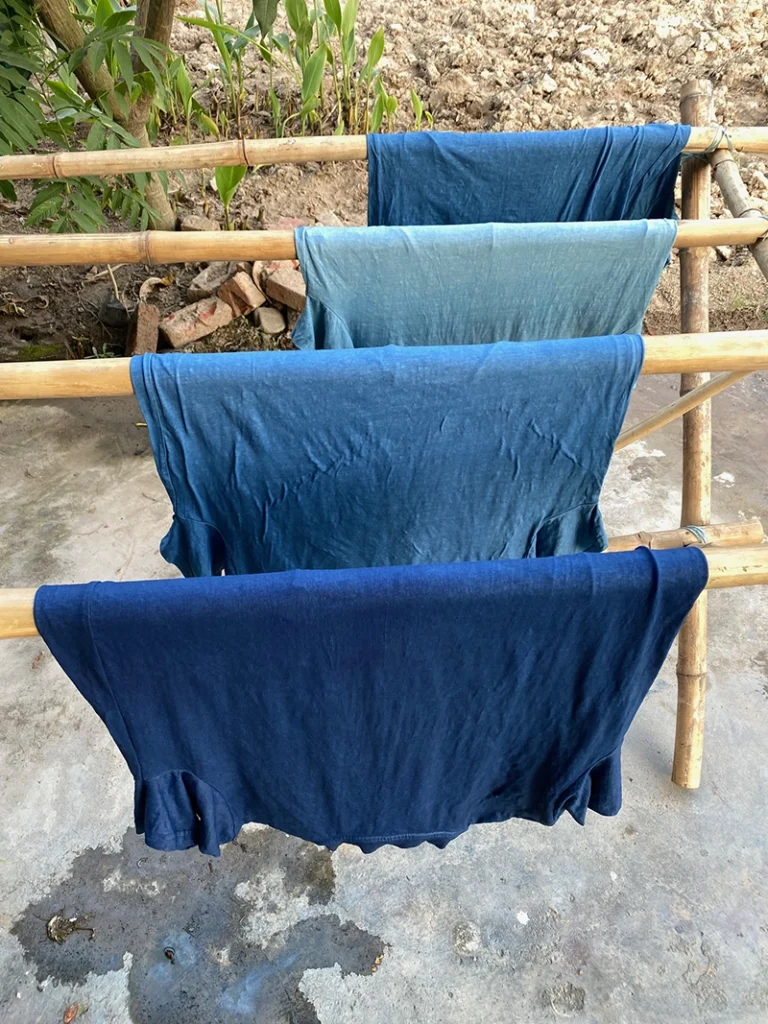 natural indigo t shirts drying after they have been dyed