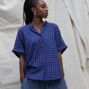 woman wearing a boxy blue check shirt