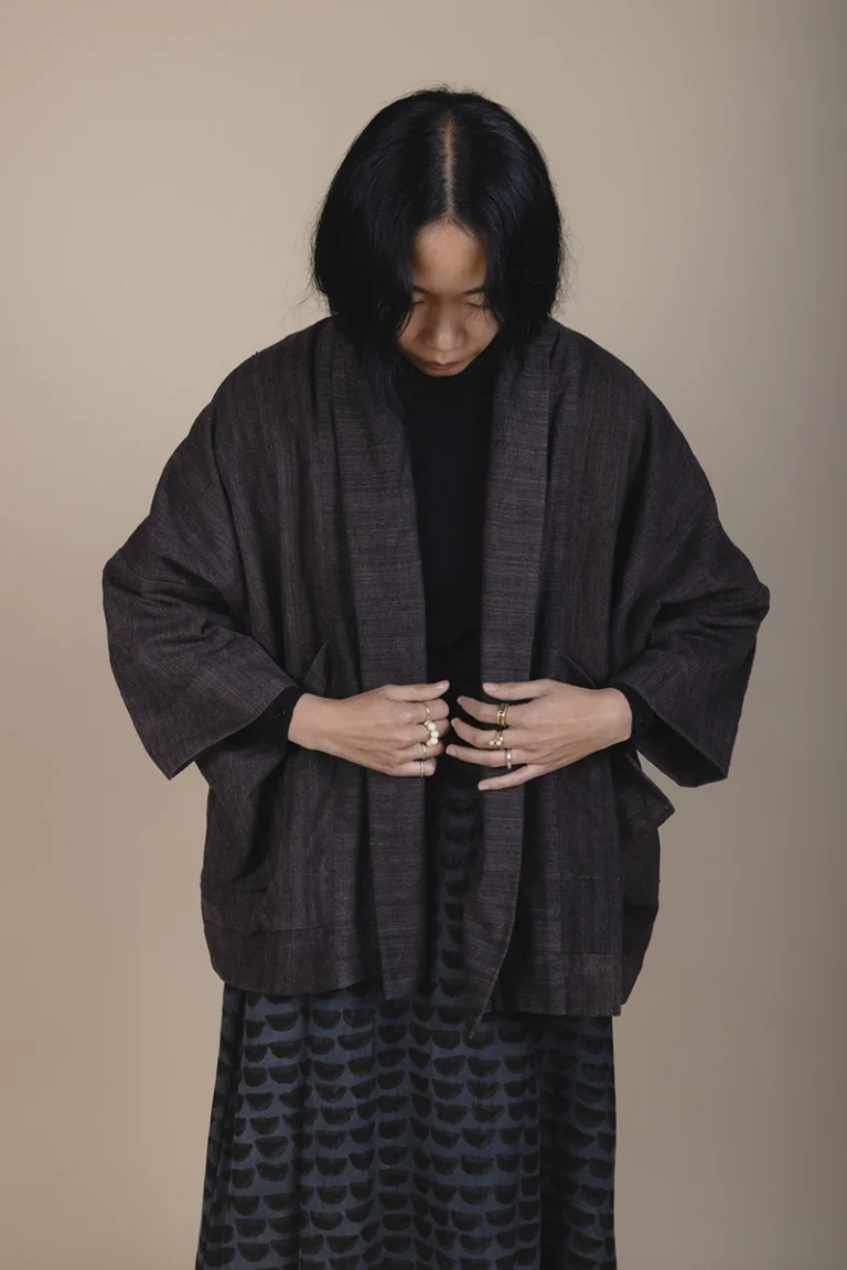 woman wearing a brown jacket