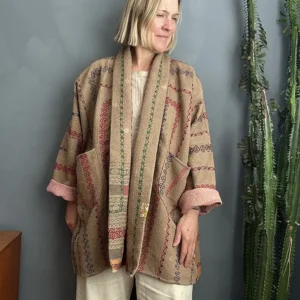 woman wearing a brown kantha jacket