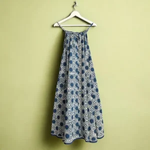hand printed artisan dress hanging on a hanger