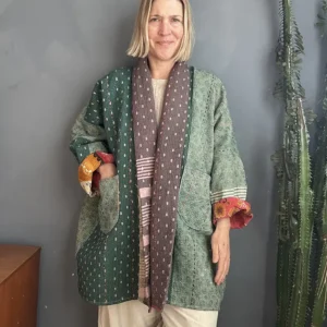 woman wearing a green patchwork kantha jacket