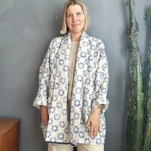 woman wearing blue and white long jacket