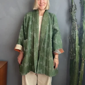 woman wearing deep green vintage kantha jacket