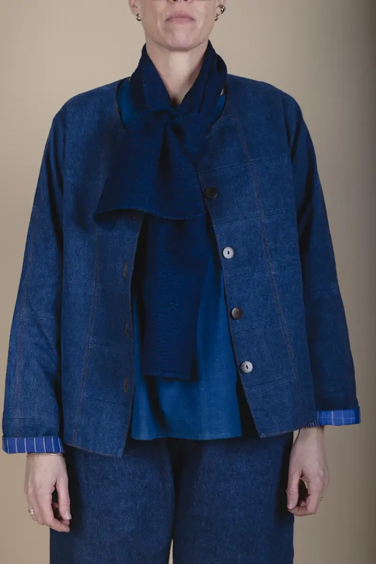 patchwork denim jacket styled with indigo scarf