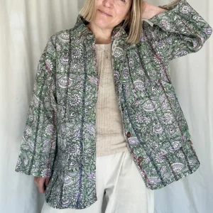 woman wearing floral kantha jacket
