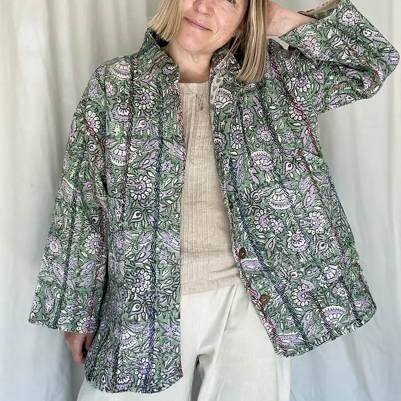 woman wearing floral kantha jacket