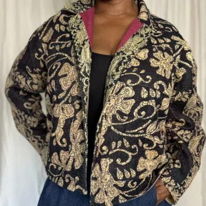 woman wearing a large floral kantha jacket