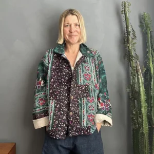 woman wearing kantha patterned fabric jacket