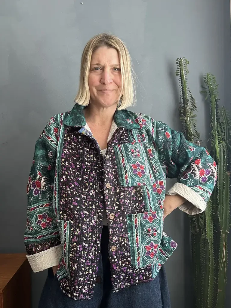 woman wearing back and green chore jacket