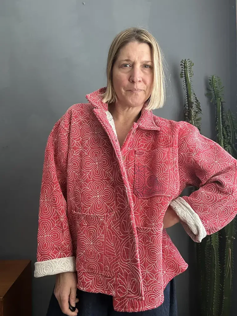 pink kantha jacket on woman