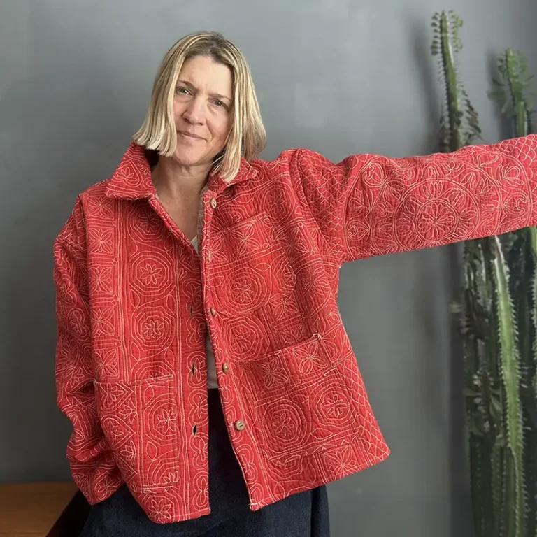 woman wearing a pink kantha quilt jacket