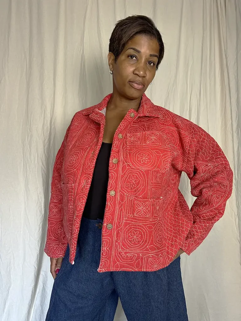 woman wearing pink kantha chore jacket