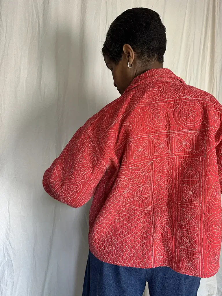 woman wearing pink kantha chore jacket