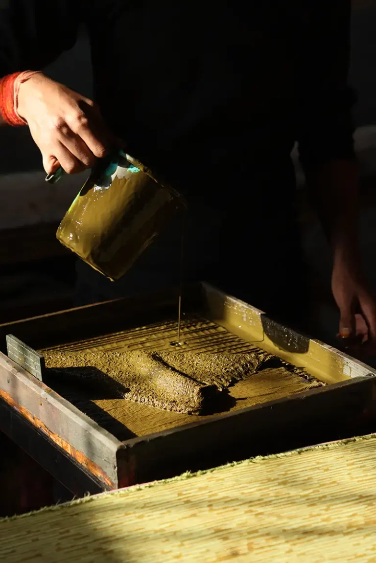 Preparing the ink for Hand-printing the Camo design onto raw GOTS-certified organic cotton fabric.