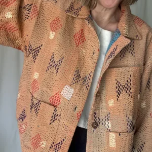 woman wearing a peach coloured kantha chore jacket