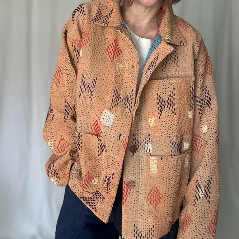 woman wearing a peach coloured kantha chore jacket