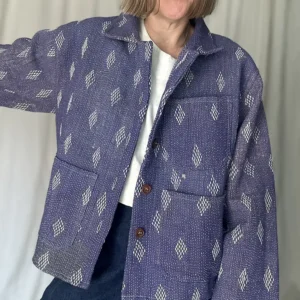 woman wearing a faded purple kantha stitched chore jacket