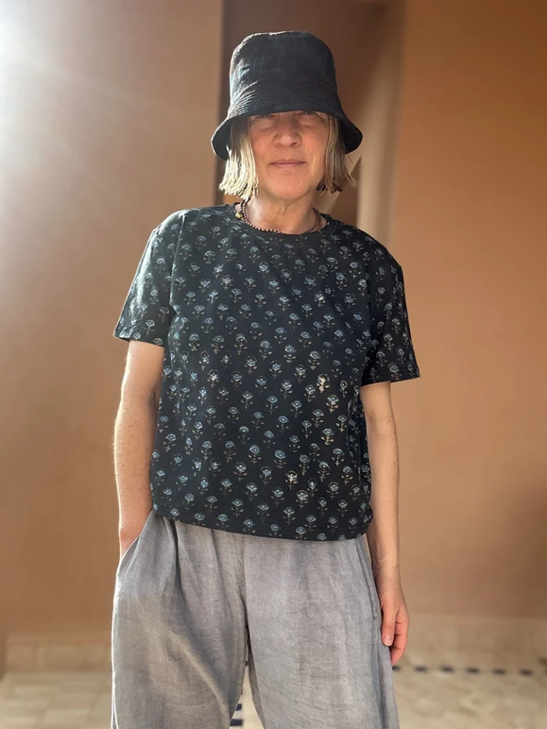 Woman wearing a relaxed boxy fit indigo floral T-shirt made from organic cotton.