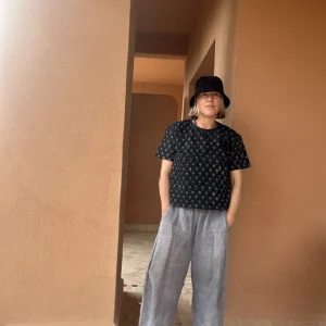 Woman wearing a relaxed boxy fit indigo floral T-shirt made from organic cotton.