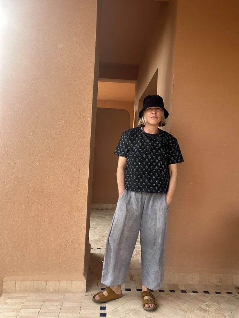 Woman wearing a relaxed boxy fit indigo floral T-shirt made from organic cotton.