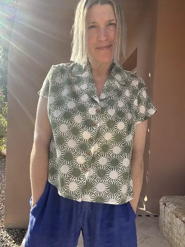 Front view of the Indigowares Sunray print short shirt in khaki green organic cotton.