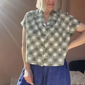 Relaxed fit Sunray block printed shirt styled with high-waisted trousers for a sustainable UK summer look.