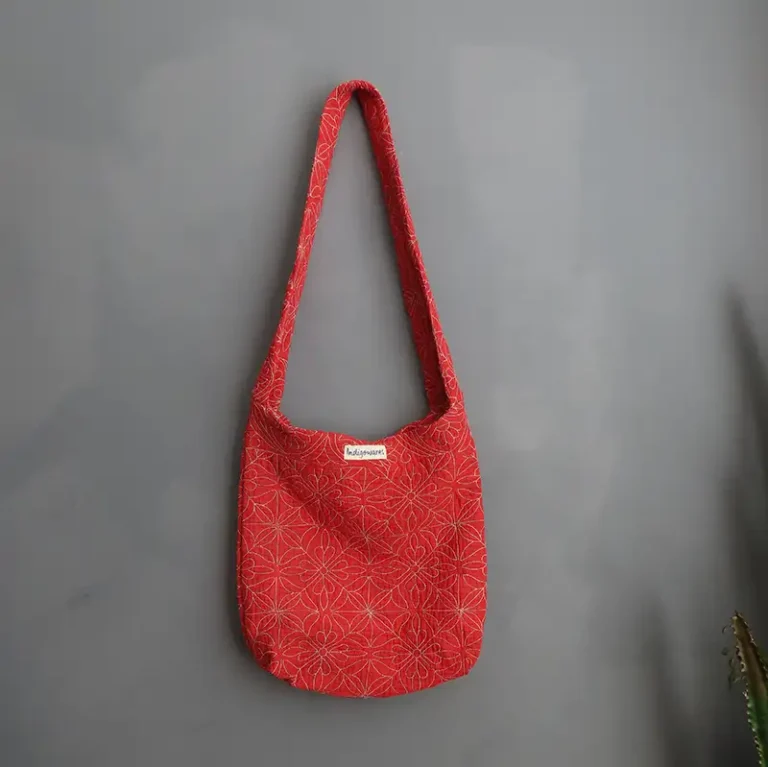 Handmade Kantha sling bag in repurposed vintage textiles by Indigowares.