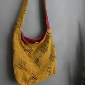 zoom in of golden yellow kantha embroidery sling bag