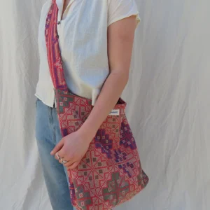 woman wearing kantha embroidery fabric sling bag