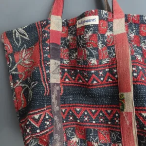 close up details of red and black patterned kantha fabric tote bag