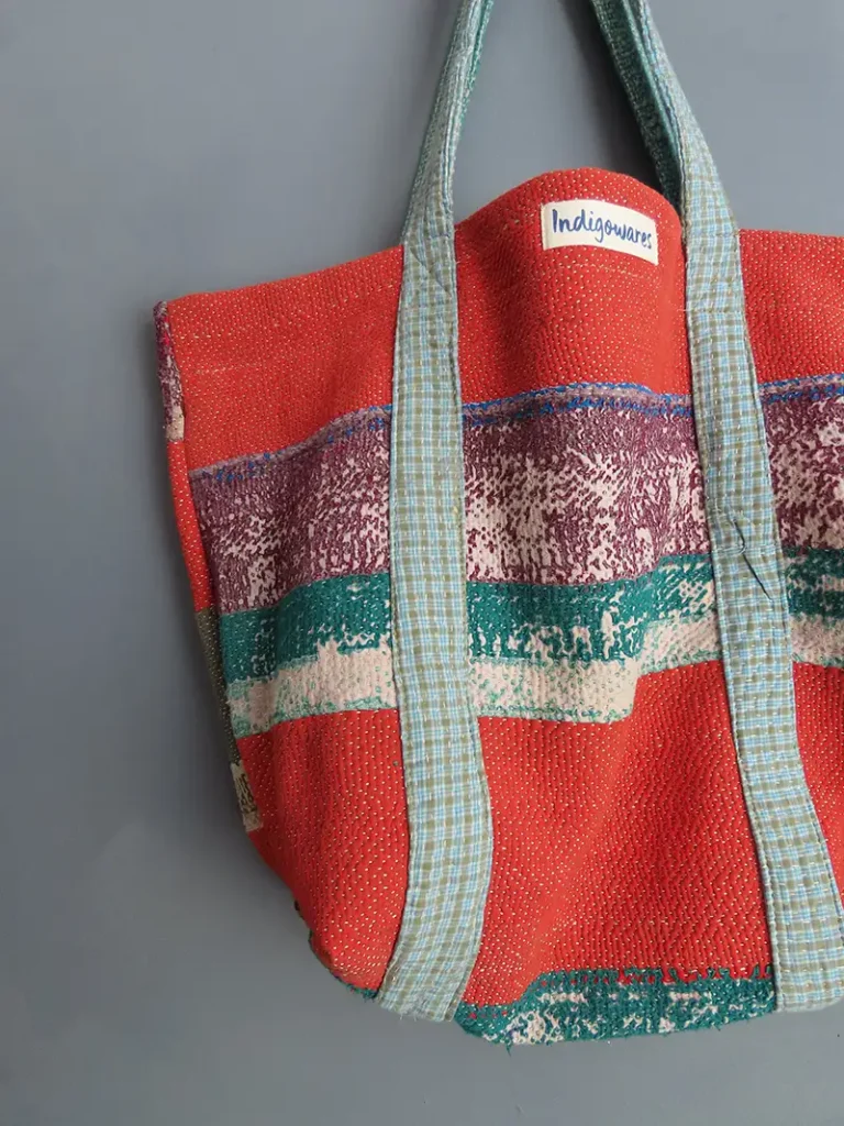 close up of red striped kantha fabric tote bag