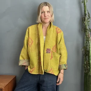 yellow kantha fabric jacket on woman