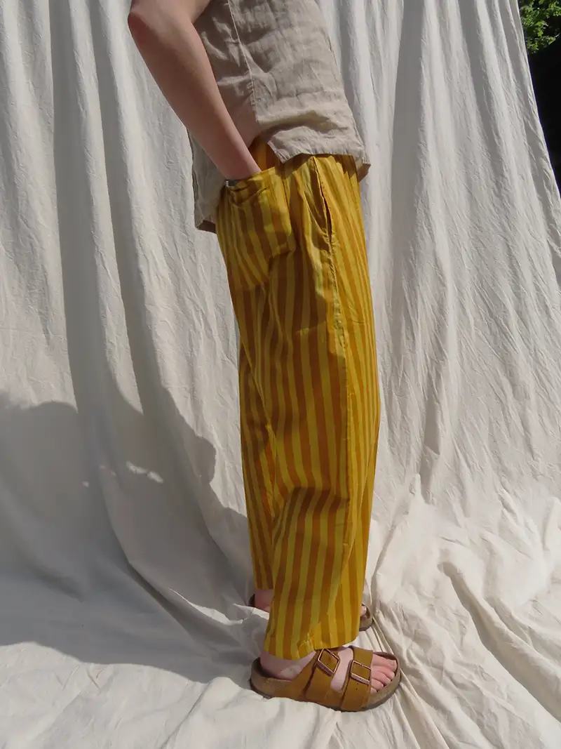 woman wearing yellow cotton trousers