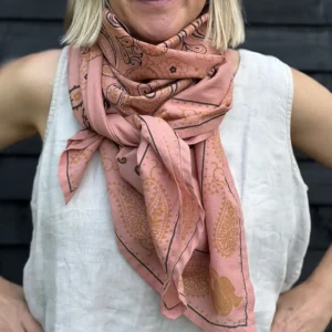 woman wearing big pink scarf