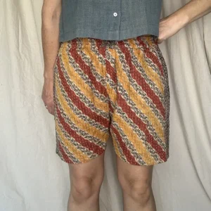 woman wearing pull on striped boho festival shorts