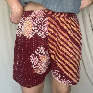 woman wearing striped boho festival shorts