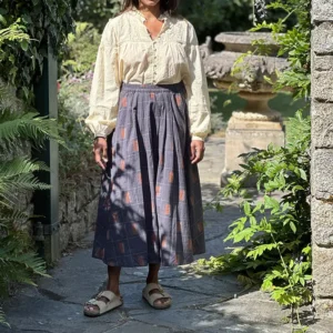 woman wearing full mid length gathered cotton skirt