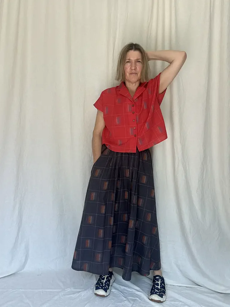woman wearing Sustainable check midi skirt