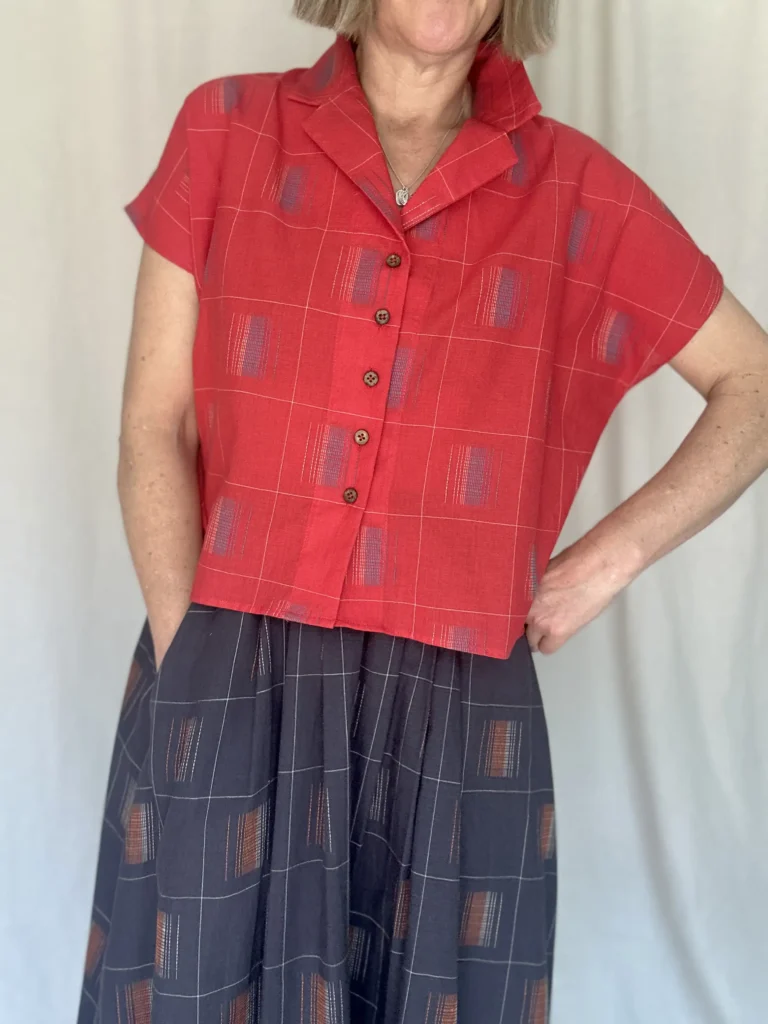 woman wearing a red short sleeved cotton shirt