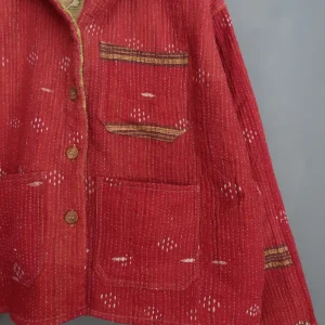 close up detail of a wine colour kantha chore jacket
