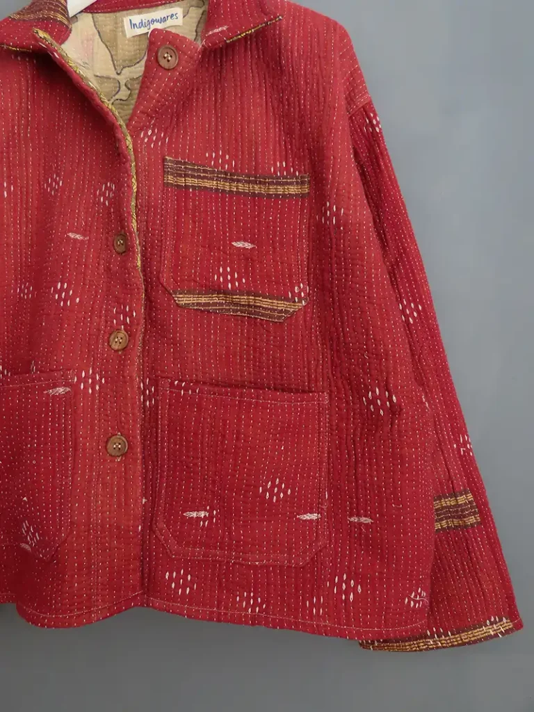 close up detail of a wine colour kantha chore jacket