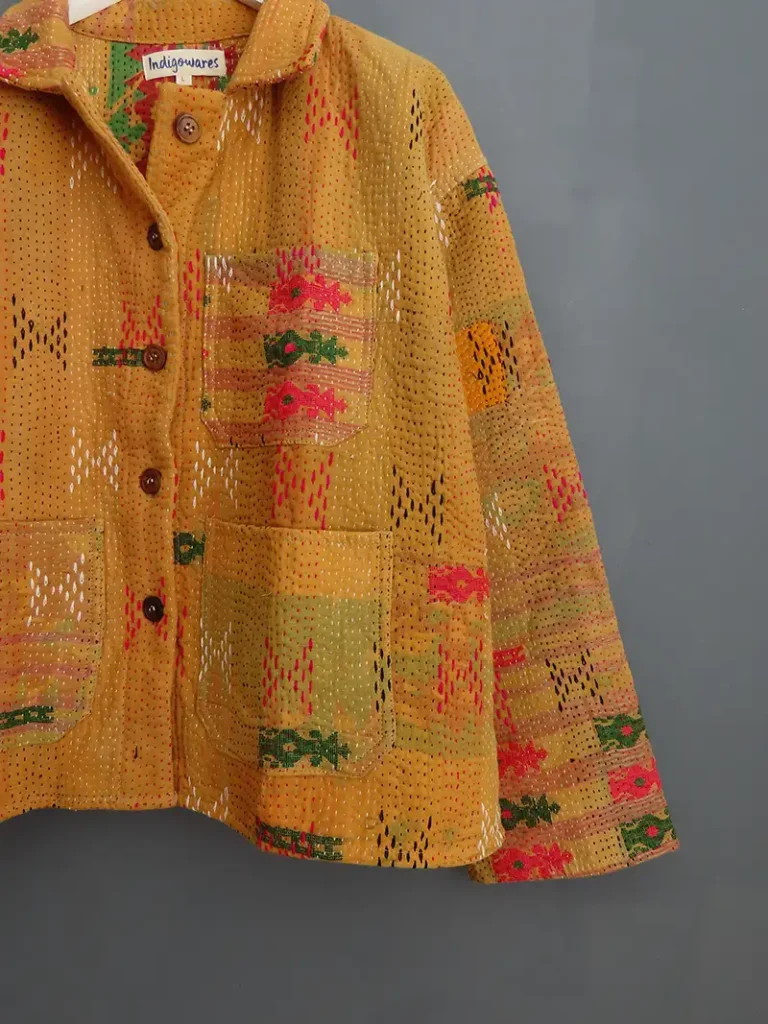 close up detail of a yellow kantha chore jacket