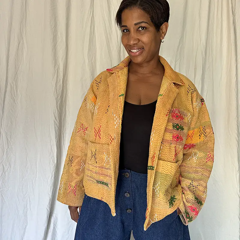 woman wearing a golden yellow kantha chore jacket