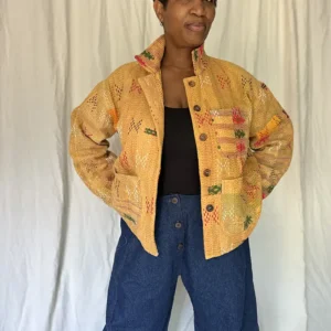 woman wearing a golden yellow kantha chore jacket