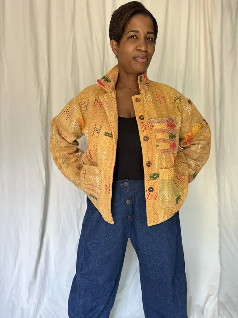 woman wearing a golden yellow kantha chore jacket