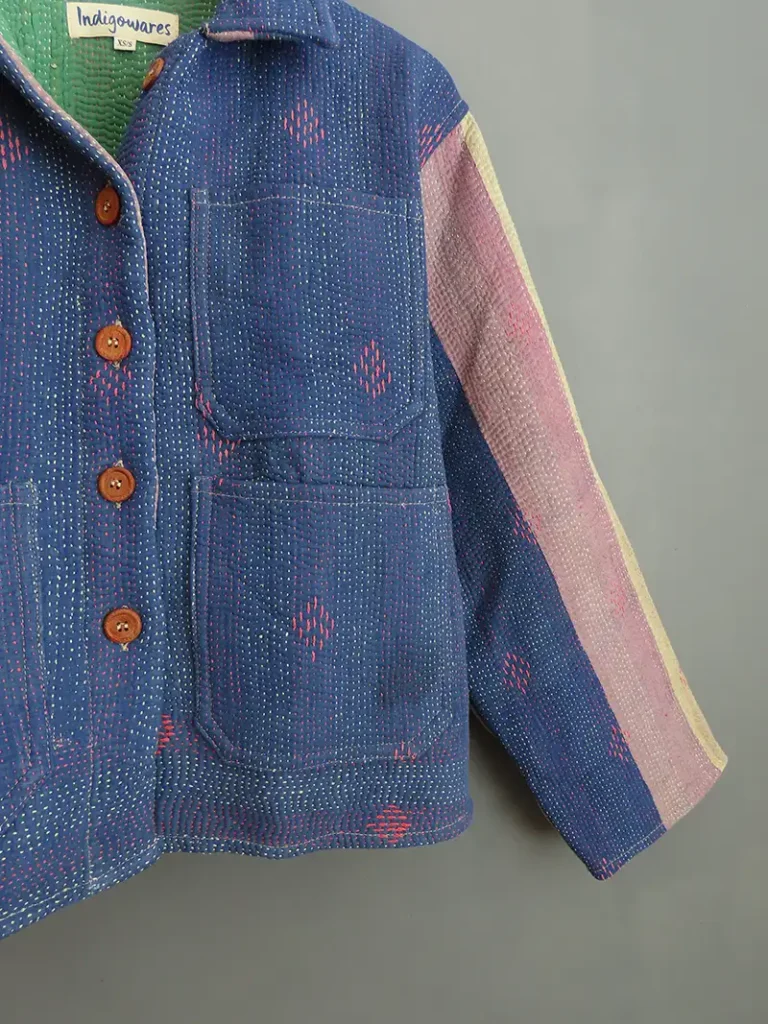 zoom in on blue kantha jacket embroidery