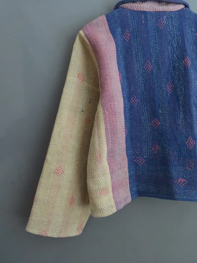 zoom in on blue kantha jacket embroidery