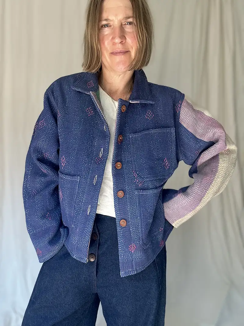 woman wearing a indigo kantha chore jacket