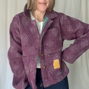 woman wearing a short purple kantha chore jacket